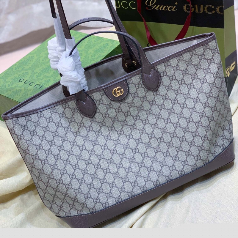 G*u*i shopping bags